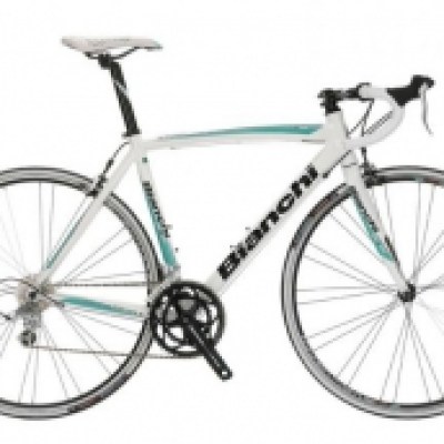 a bicycle leaning against a wall