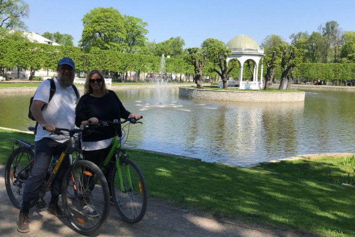 a man riding on the back of a bicycle