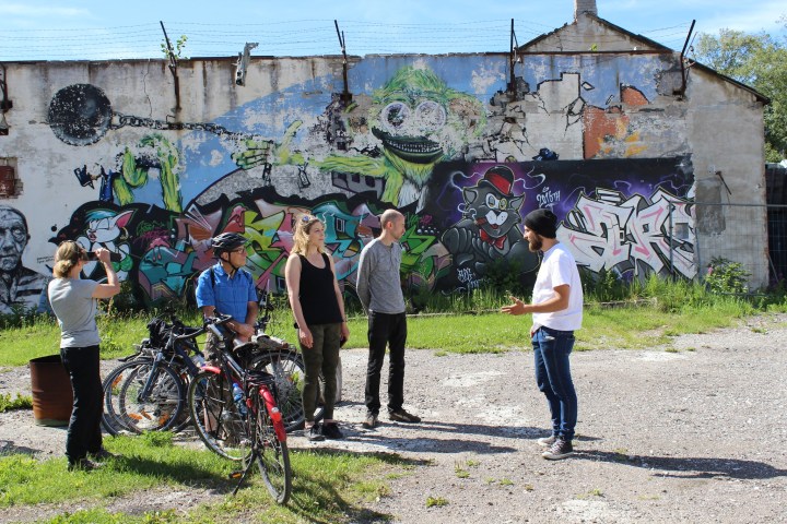 a group of people standing in front of a building in Tallinn