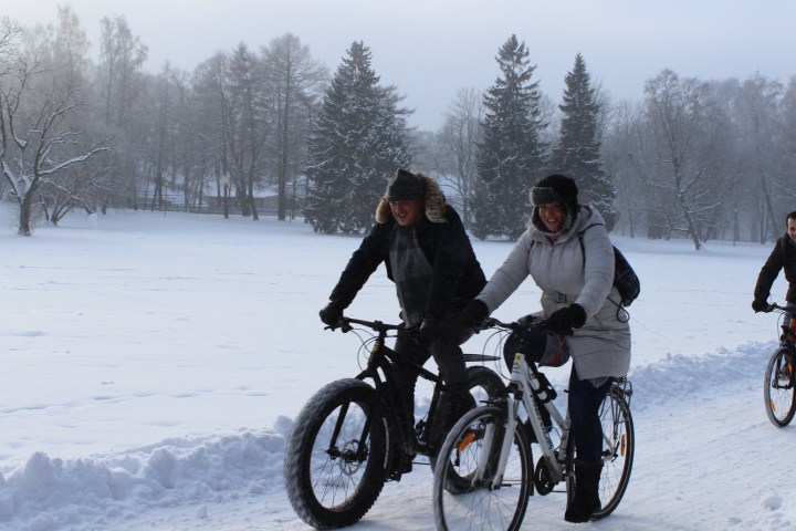 a person riding a bicycle in the snow in Tallinn