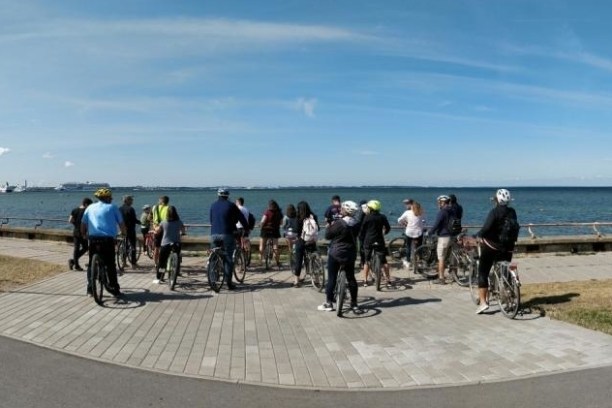 a group of people cycling near a beach in Tallinn