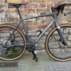 a bicycle parked on the side of a building in Tallinn