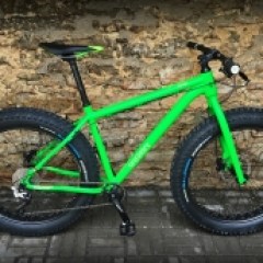 a bicycle is parked next to a building in Tallinn