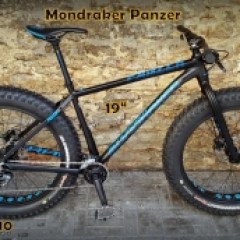 a bicycle is parked next to a building in Tallinn