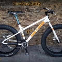 a bicycle is parked next to a building in Tallinn