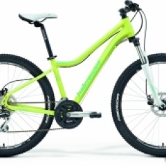 a bicycle leaning against a wall