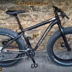 a bicycle is parked next to a building in Tallinn