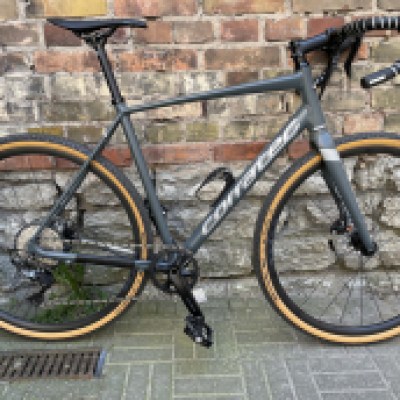 a bicycle parked in front of a building in Tallinn
