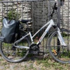 a bicycle parked on the side of a building in Tallinn