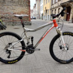 a bicycle parked on the side of a building in Tallinn