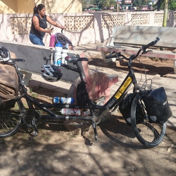 a bicycle is parked next to a motorcycle