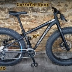 a bicycle is parked next to a building in Tallinn