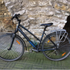 a bicycle parked on the side of a building in Tallinn