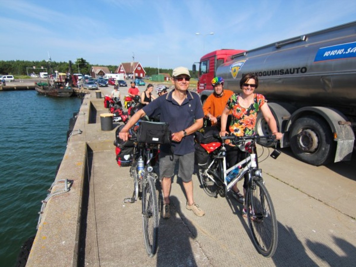 a man riding a bicycle on a boat in the water