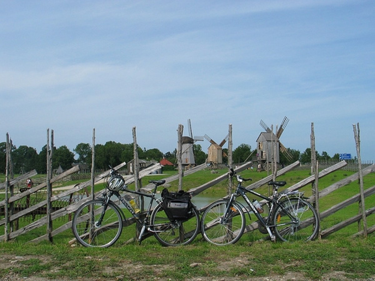 a bicycle is parked near a fence