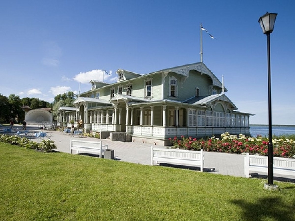 a clock sitting in the grass
