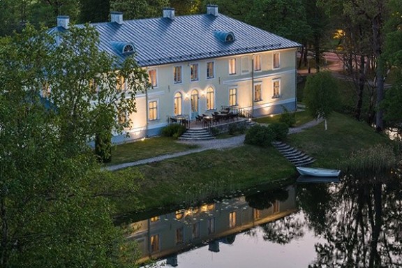 a house with trees in the background