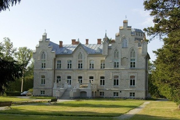 a castle on top of a grass covered field