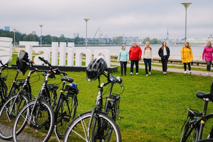 a person standing in front of a bicycle