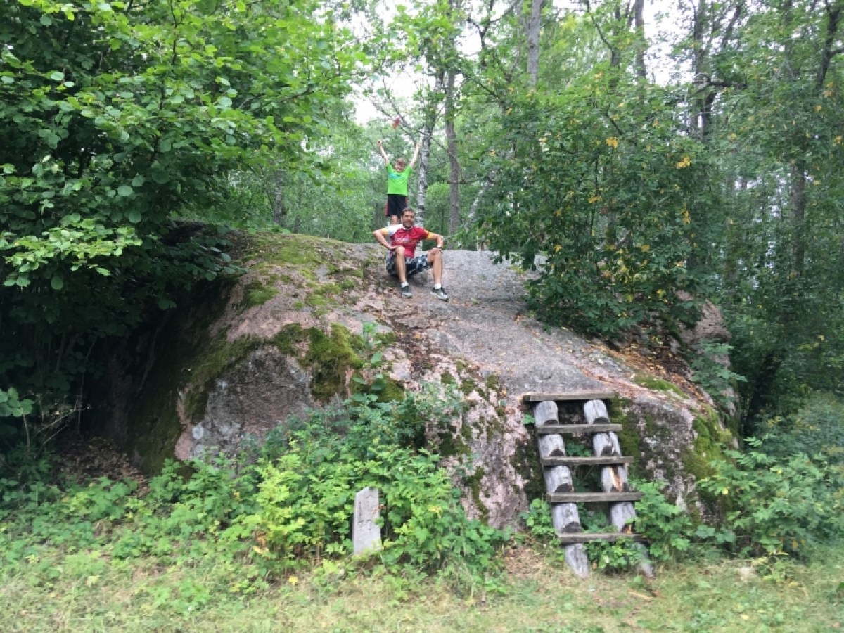a person riding a bike down a dirt road