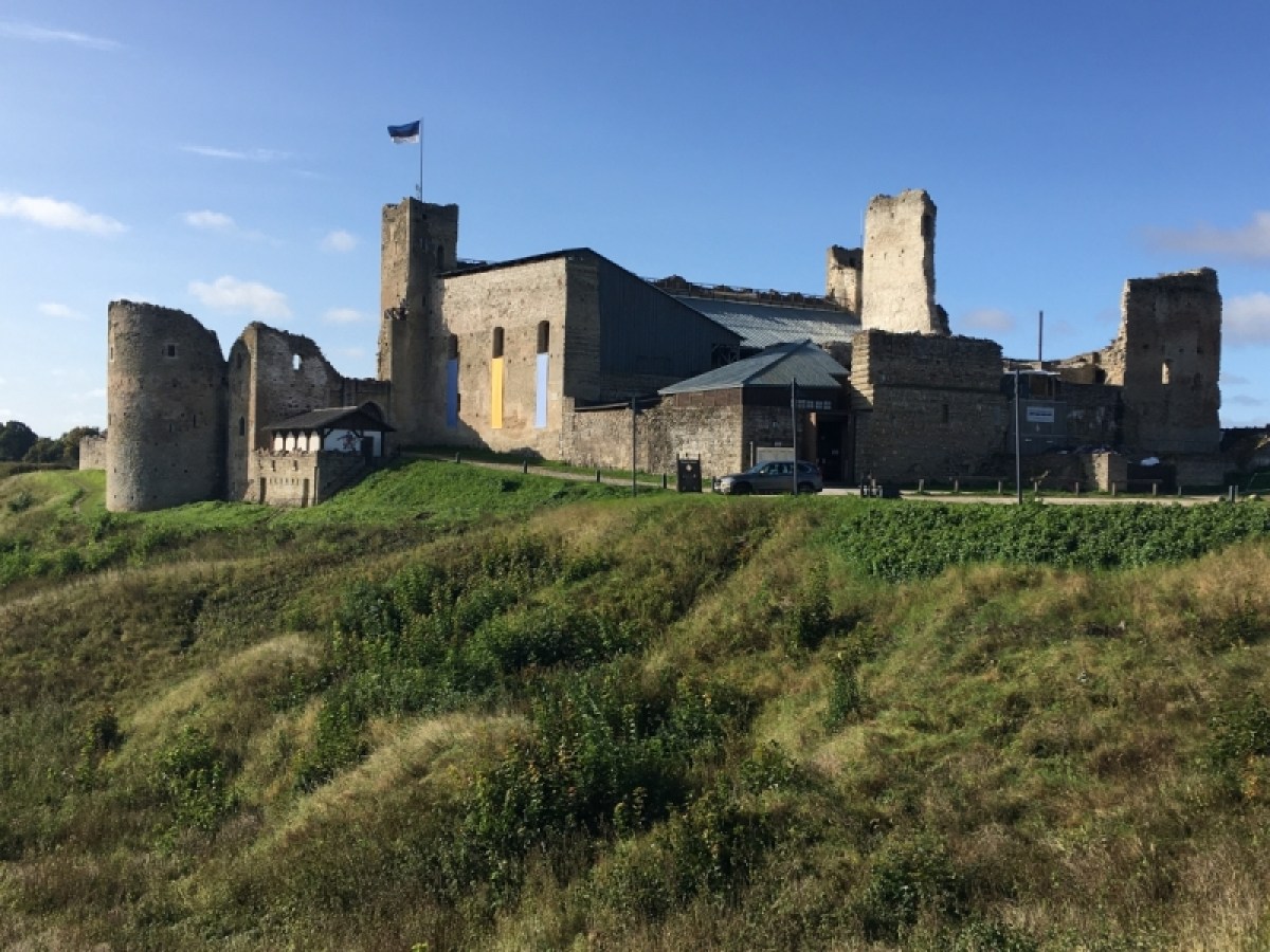 a castle on a grassy hill