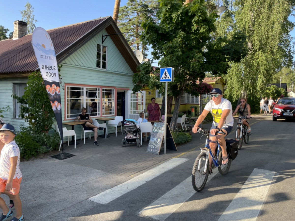 a man riding a bicycle down the street
