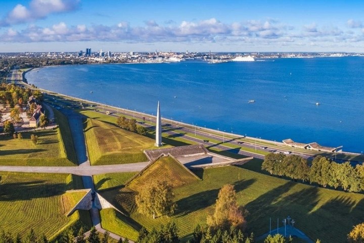 a view of a large body of water with a city in the background