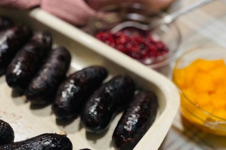 a cake with fruit on top of a table
