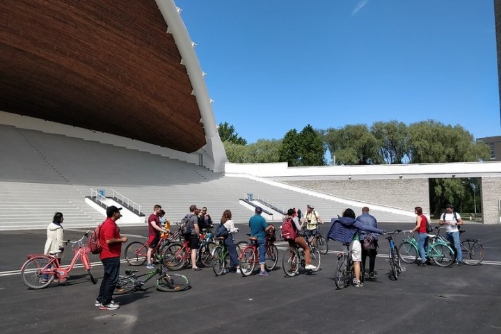 a group of people standing in a parking lot
