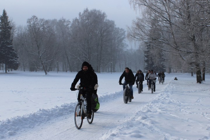 a group of people cross country skiing in the snow
