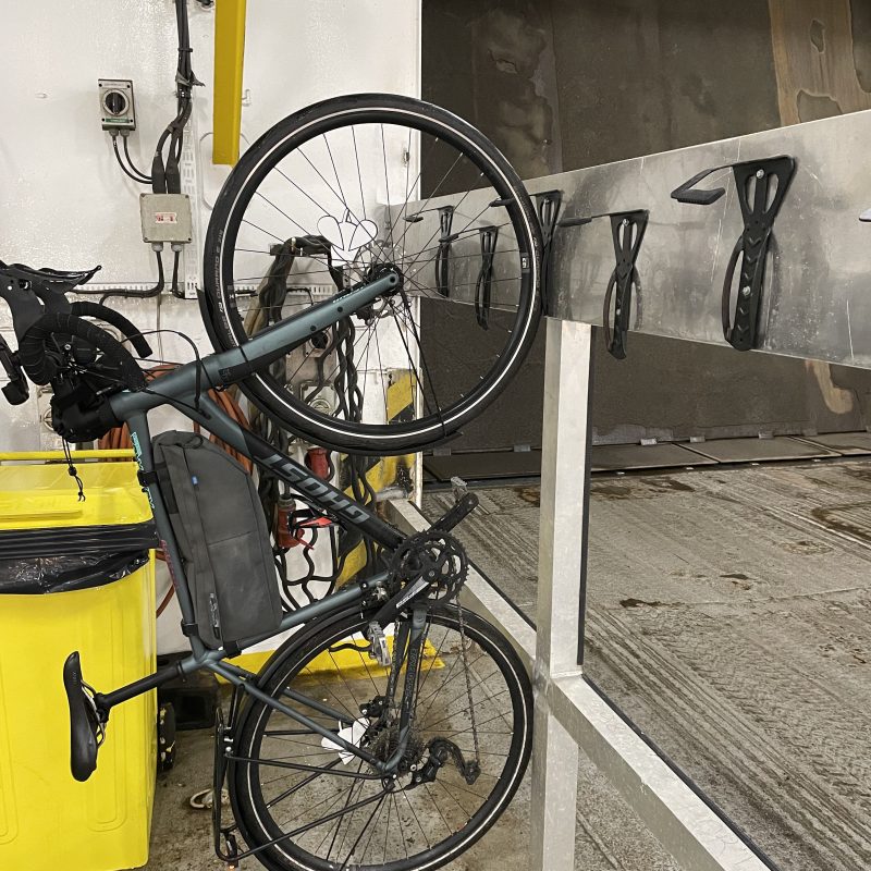 a bicycle parked on the side of a building