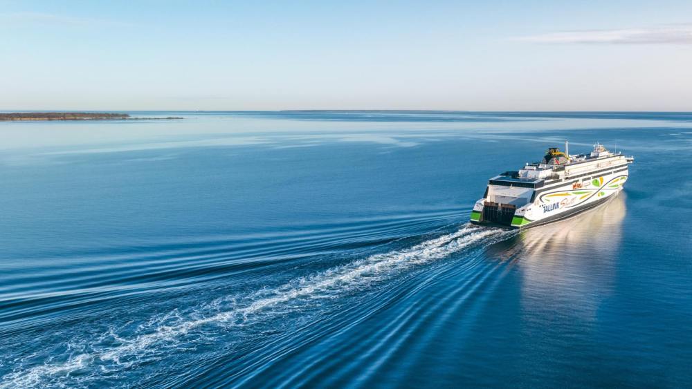 a boat traveling along a body of water