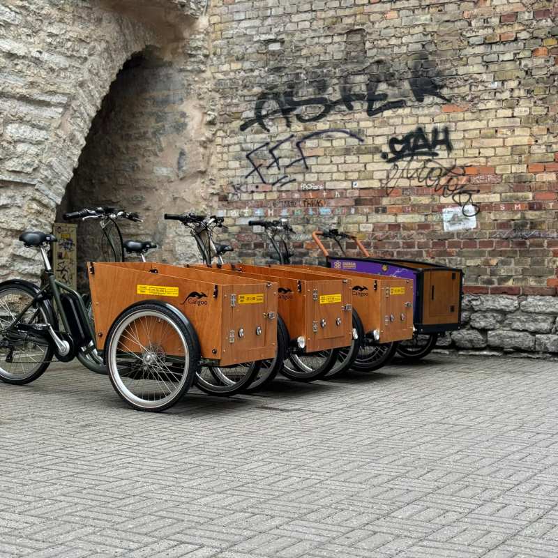 a stone building that has a bicycle on a brick wall
